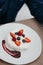 Close-up of beautiful pavlova cakes with strawberries and blueberries. Selective focus