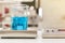 Close up of beautiful vortex blue colorful chemistry liquid in beaker laboratory flask on magnetic stirrer or mixer machine for