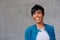 Close up beautiful young black woman with blue jacket smiling