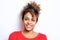 Close up beautiful young black woman with hair bandana smiling against white wall