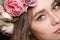 Close up of beautiful young woman in rose wreath