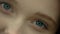Close-up of a beautiful young woman`s green eye. Macro green eye of beautiful woman. Closeup portrait. woman`s eyes