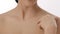 Close up beauty portrait of beautiful woman touching healthy skin and bare shoulders in slow motion