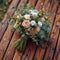 Close up beauty rustic wedding bouquet with creamy roses and carnations