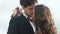 Close-up of beayutiful wedding couple kissing on wedding day. Young pretty girl embraces lovely handsome man
