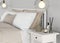 Close-up on the bed, bedside table and pendant lamp