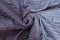 Close up of bed blue twisted blanket top view. Sleeping bedroom. Copy space and mock up. Template home background. Textured cloth