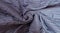 Close up of bed blue twisted blanket top view. Sleeping bedroom. Copy space and mock up. Template home background. Textured cloth