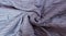 Close up of bed blue twisted blanket top view. Sleeping bedroom. Copy space and mock up. Template home background. Textured cloth