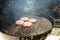 Close Up of Beef Hamburger Cooking on a Charcoal Grill