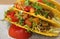 Close up of beef tacos with salsa sauce, tasty Mexican fast food