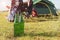 Close up of beer bottle in meadow while camping at outdoors. Holiday and Vacation concept. Adventure and outdoors theme.