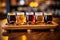 close-up of beer sampler glasses on wooden tray