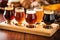 close-up of beer sampler glasses on wooden tray