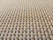 Close-up of beige fabric plastic lattice, grid texture; pattern of horizontal and vertical interwoven lines may be used as a backg