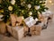 Close up of beige gift boxes under decorated christmas tree