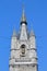 Close-up on The Belfry clocktower, located at Saint Bavo`s Square in Ghent