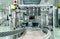 Close up Belt conveyor glass bottles into beverage filling machine