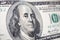 The close-up of Benjamin Franklin\'s face on the 100 dollar bill