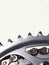 Close-up of a bicycle chain and sprockets with white background