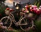 A close up of a bicycle covered in flowers with a building in the background