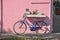 Close-up of bicycle leaning against colorful wall on a sunny day in Burano.