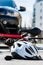 Close-up of a bicycling helmet on the asphalt after car accident