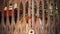 A close-up of a big Buddha statue in a temple in Nepal, Kathmandu through blurred rusty grating, fence.