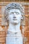 Close-up of a big marble head bust statue of Julius Caesar in the Vatican Museum garden, Rome, Italy. Courtyard of the Pigna