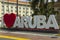 Close up big white capital letters I love Aruba along a road in the center of Oranjestad, the capital of Aruba.