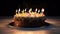 Close-up of a birthday cake with burning candles on a dark background, isolate. AI generated