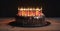 Close-up of a birthday cake with burning candles on a dark background, isolate. AI generated