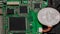 Close-up of bitcoin, computer circuit board with bitcoin processor and microchips. Electronic currency, internet finance rypto cur