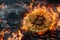A close up of a bitcoin on a computer motherboard that is on fire