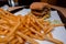 Close up of a bitten double cheeseburger on a tray