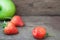 Close up of bitten strawberry on wooden table