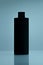 Close up of a black bottle on tile blue background. cosmetic mock up. branding identity mockup concept