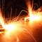 Close up of black burned sparklers producing multiple sparks, created using generative ai technology