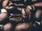 Close up of Black coffee beans with a natural bitter taste, with blurry background