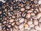 Close up of Black coffee beans with a natural bitter taste, with blurry background