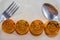 Close-up Black food plate, with spoon and golden bitcoin on white background