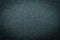 Close-up of black gray plastic material seamless texture. Surface of rough abstract dark black matte background.