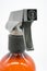 Close up black plastic nozzle of brown transparent spray bottle