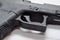 A close up of a black semi automatic pistol