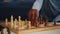 Close up of black woman moving chess pieces on board