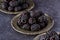 Close up blackberries in plate on dark background