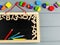 Close up of blackboard with numbers and Multicolored math fractions on the on gray wooden table. Interesting math for kids