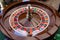 A close up of a blackjack dealer& x27;s hands in a casino, very shallow depth of field.