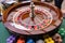 A close up of a blackjack dealer's hands in a casino, very shallow depth of field.