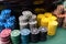 A close up of a blackjack dealer's hands in a casino, very shallow depth of field.